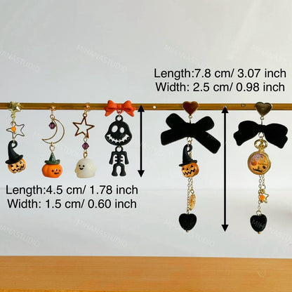 Halloween-themed earrings with measurements on a white background